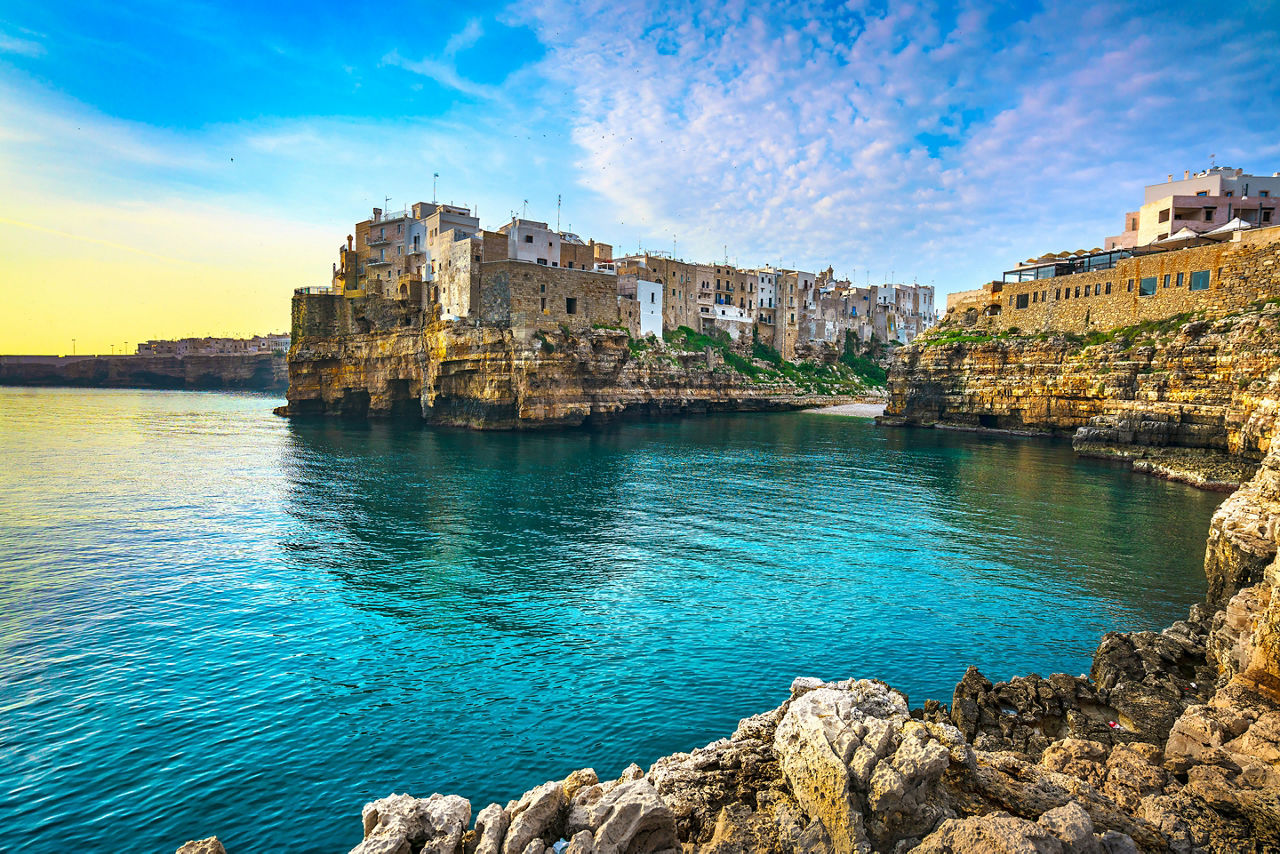 Polignano a Mare village on the rocks at sunrise, Bari, Apulia